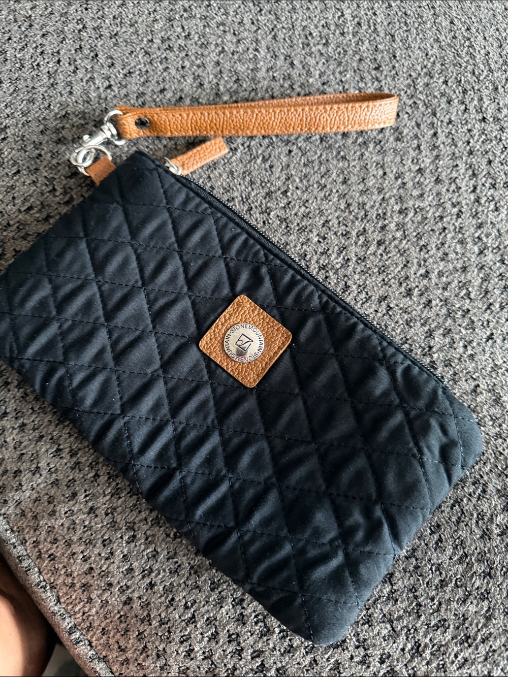 Stone Mountain 
Black Quilted Wristlet Clutch with Tan leather  Accent